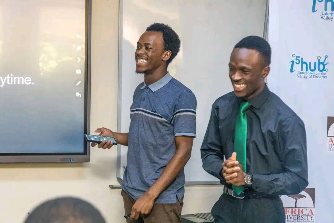 A picture of Tapiwa and I in front of the judges as we started presenting our pitch