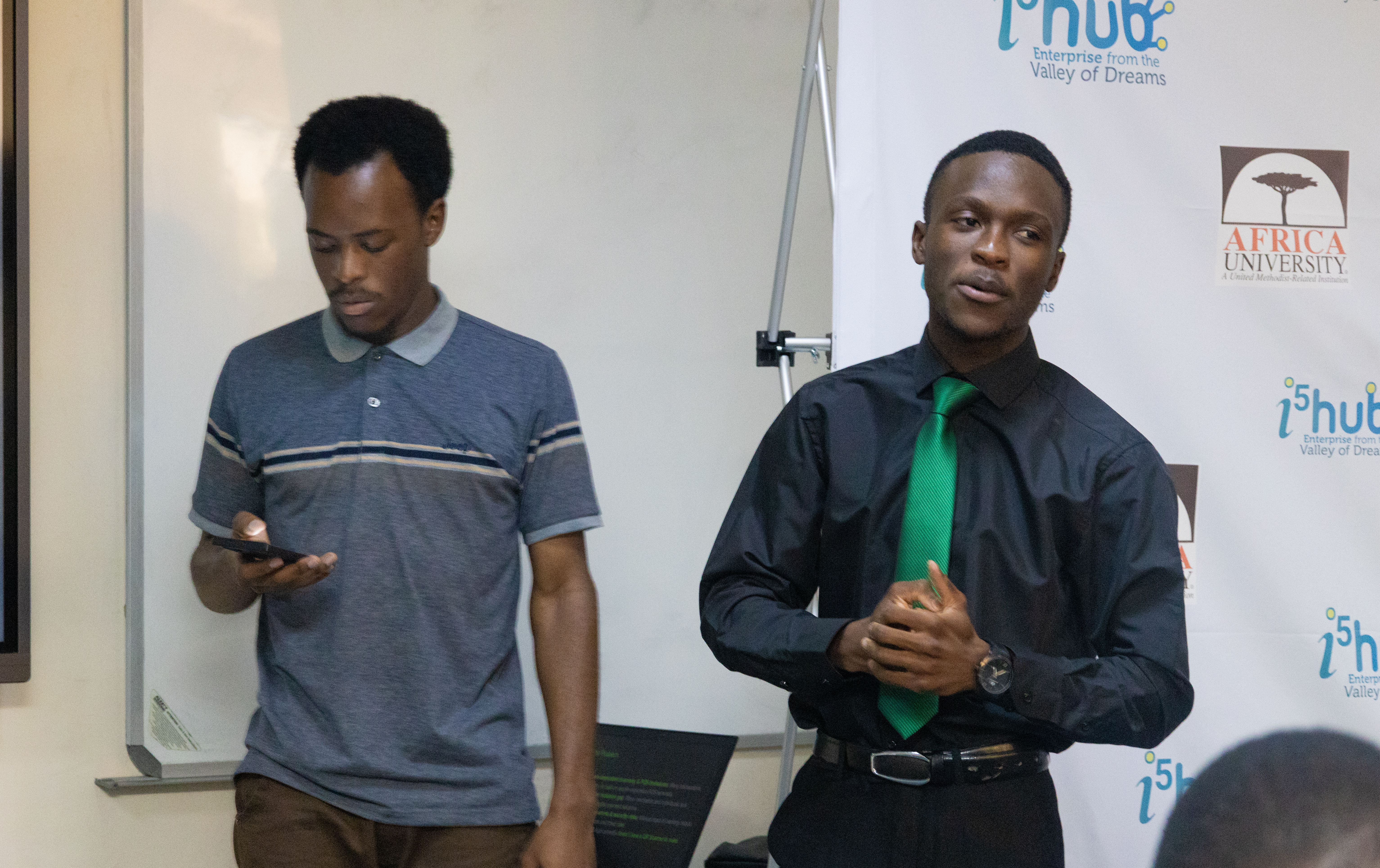 A picture of Tapiwa and I in front of the judges as we started presenting our pitch